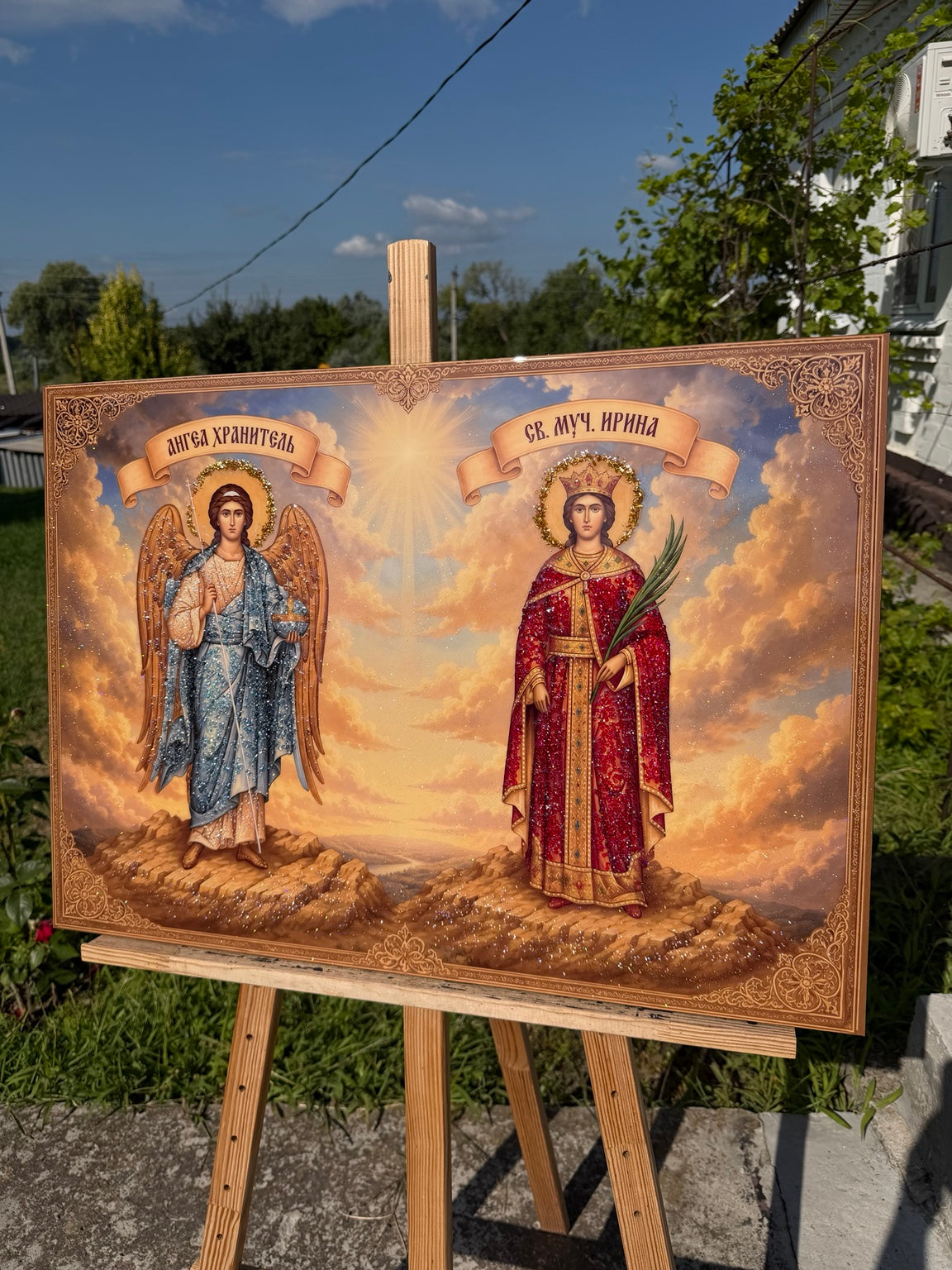 Ангел-охоронець у блакитному вбранні та Свята мучениця Ірина у червоному на золотистому тлі